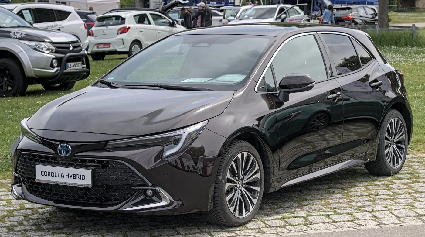 Toyota Corolla Hybrid hatchback parked on an Irish country road, front three-quarter view